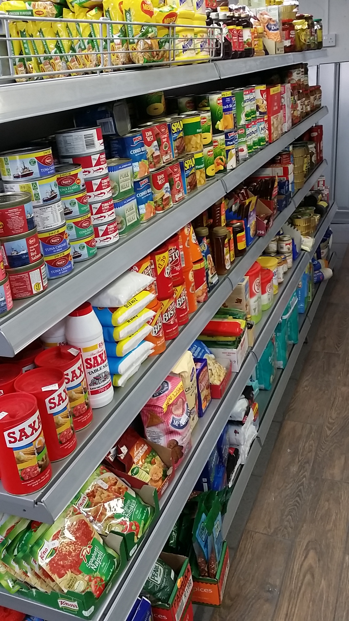 Silver Wall Shelving in Convenience Store